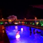 The Founder of CoolBiz Web Design's Swimming Pool at Night with Glowing LED Lights and Light up LED Floating Balls in the Pool