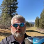 The Founder of CoolBiz Web Design Wearing Sunglasses on a Golf Course Holding a Golf Club at Running Y Resort in Klamath Falls, Oregon