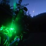 Harley with Green LED Lights Glowing with Night Sky in the Background