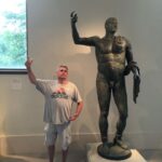 Picture of CoolBiz Web Design's Founder Standing by a Statue at the Metropolitan Museum of Art in New York City