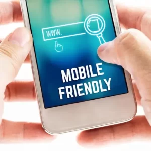 A Picture of Hands Holding a Cell Phone Showing the Phrase, Mobile Friendly on the Screen